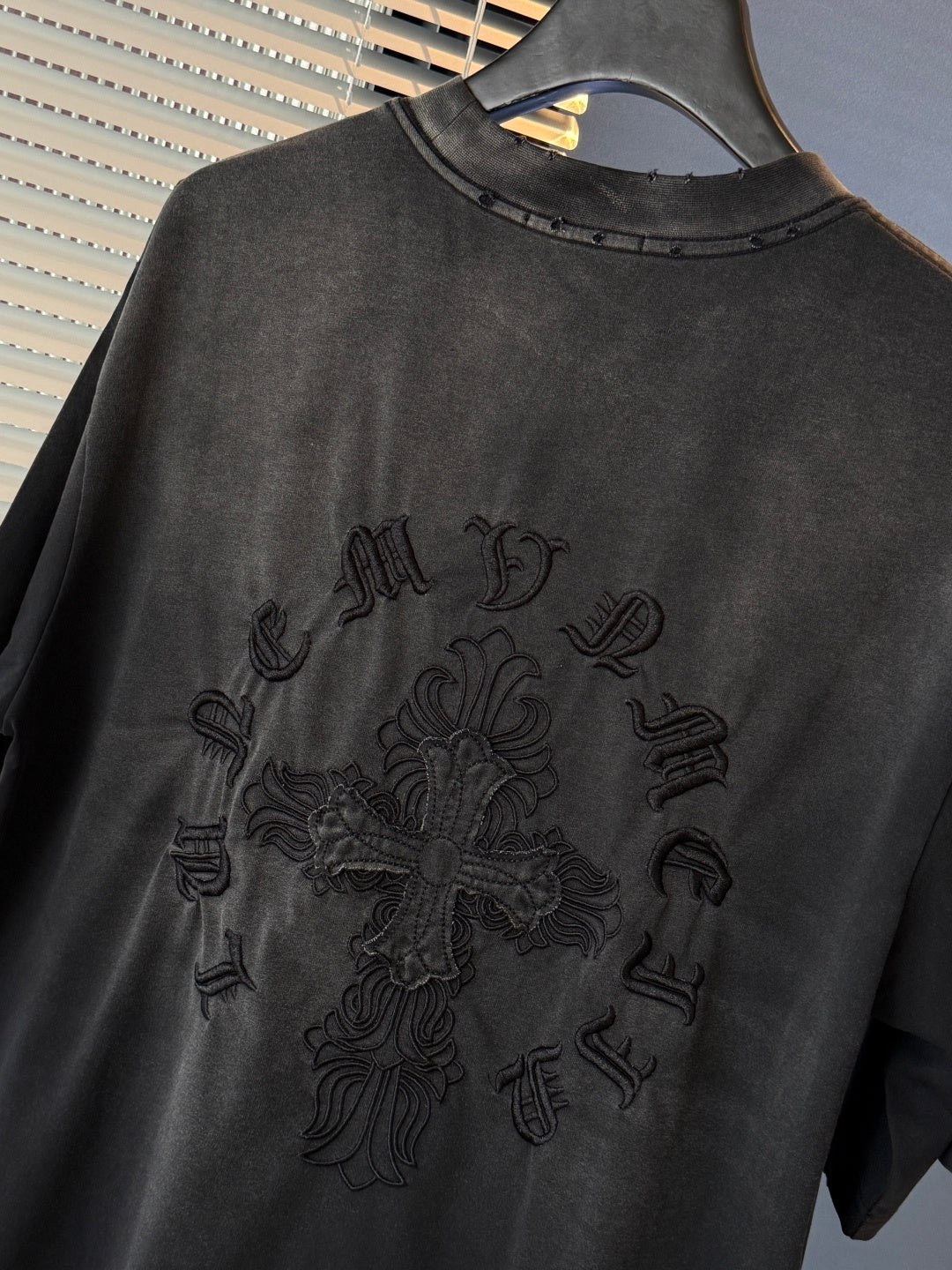 Black short-sleeve T-shirt with embroidered-style chest dragon graphic
