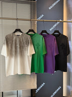 Short-sleeve T-shirts: off-white, green, purple, and black with small chest graphic