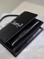 YSL black leather clutch bag with flap and silver YSL logo, chain strap