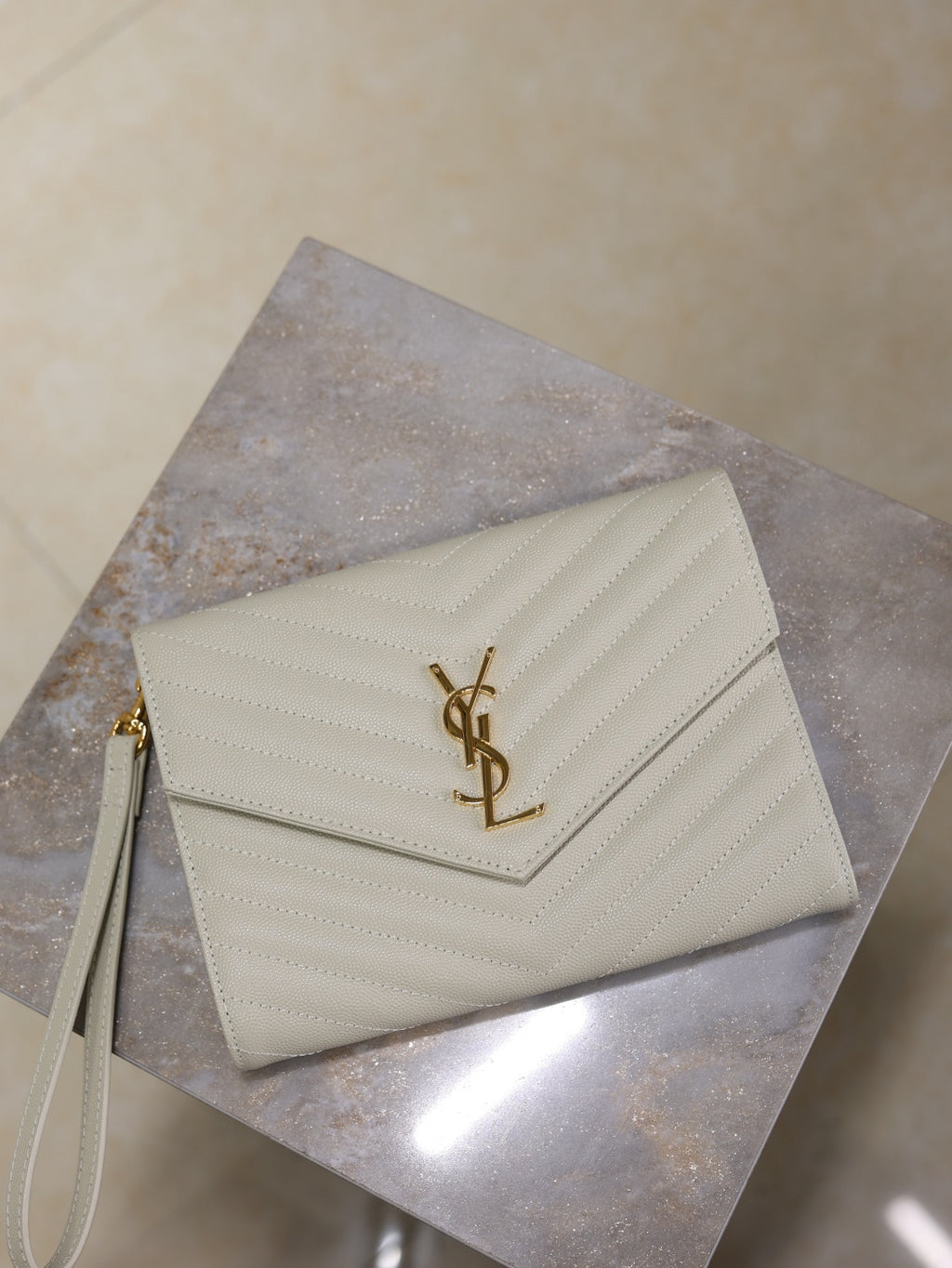 Women’s YSL small shoulder bag, white quilted chevron with gold YSL logo on front