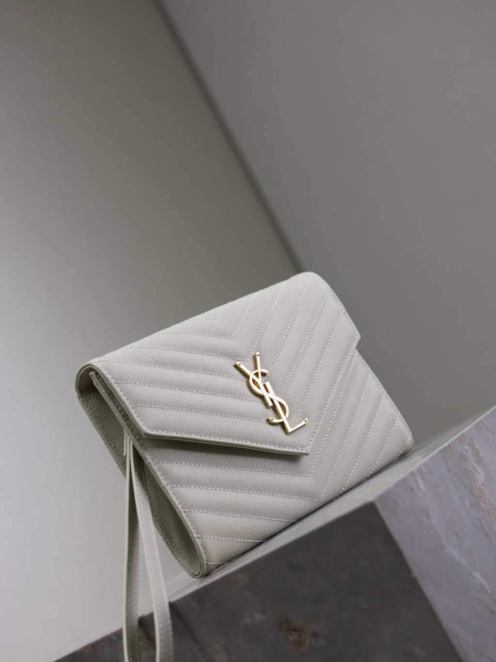 YSL white quilted shoulder bag with front flap and gold YSL monogram clasp