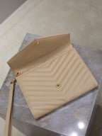 Quilted shoulder bag in light beige with gold hardware and top flap