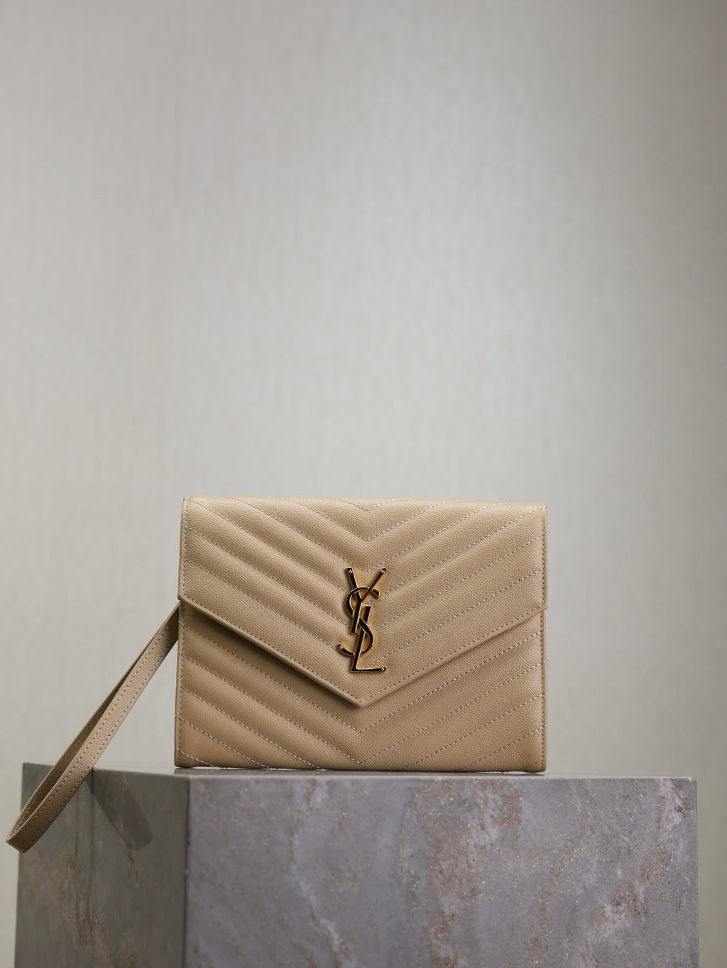 YSL quilted shoulder bag in light beige with YSL logo and top flap