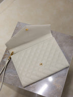 Small quilted shoulder bag, light white with front stud snap and wrist strap.