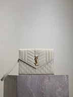 Small quilted YSL logo shoulder bag, light white with flap and gold clasp.
