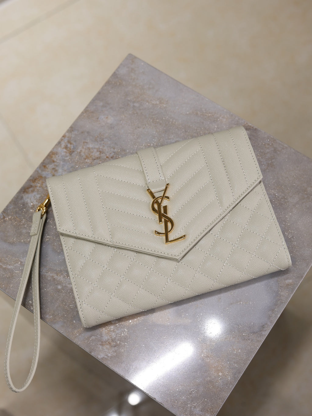 Small YSL logo envelope-style shoulder bag, light white quilted leather.