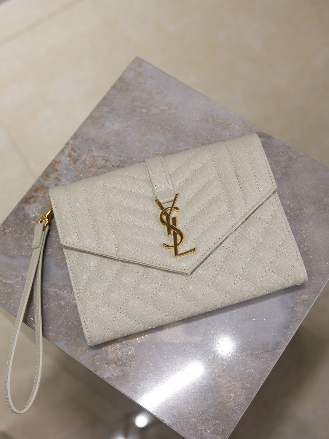 Small YSL logo envelope-style shoulder bag, light white quilted leather.
