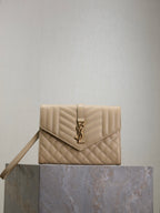 Women’s YSL small bag in light beige quilted leather with front YSL logo and flap