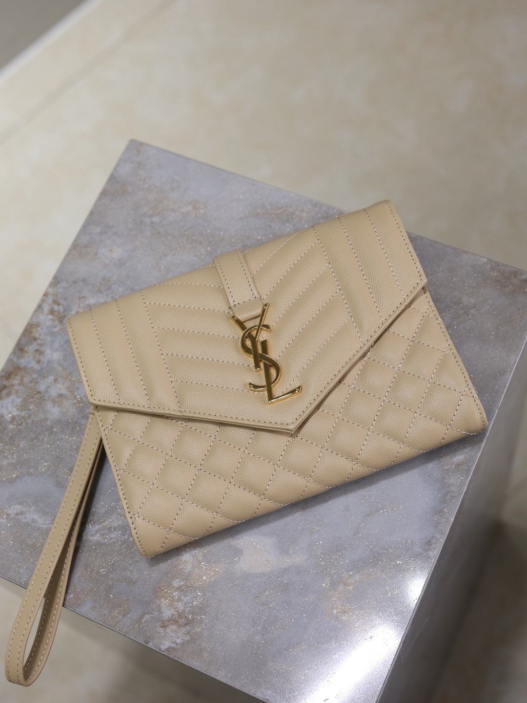 YSL quilted beige flap shoulder bag with gold YSL logo on front
