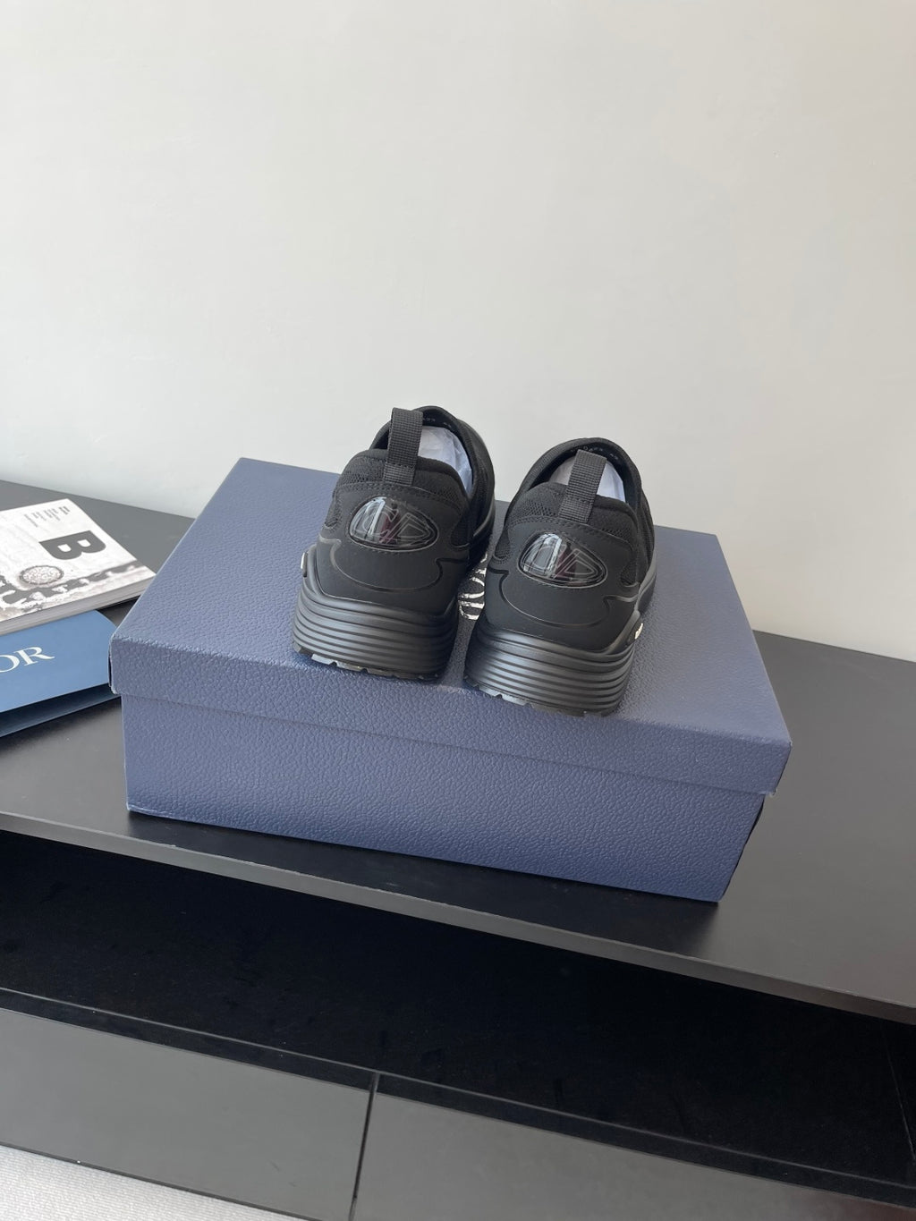 Pair of Dior slip-on sneakers, dark gray with low stacked sole and pull tabs