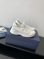 White Dior sporty sneakers with wavy side logo detailing and lace-free design