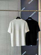 White and black short-sleeve T-shirts on hangers with plain fronts