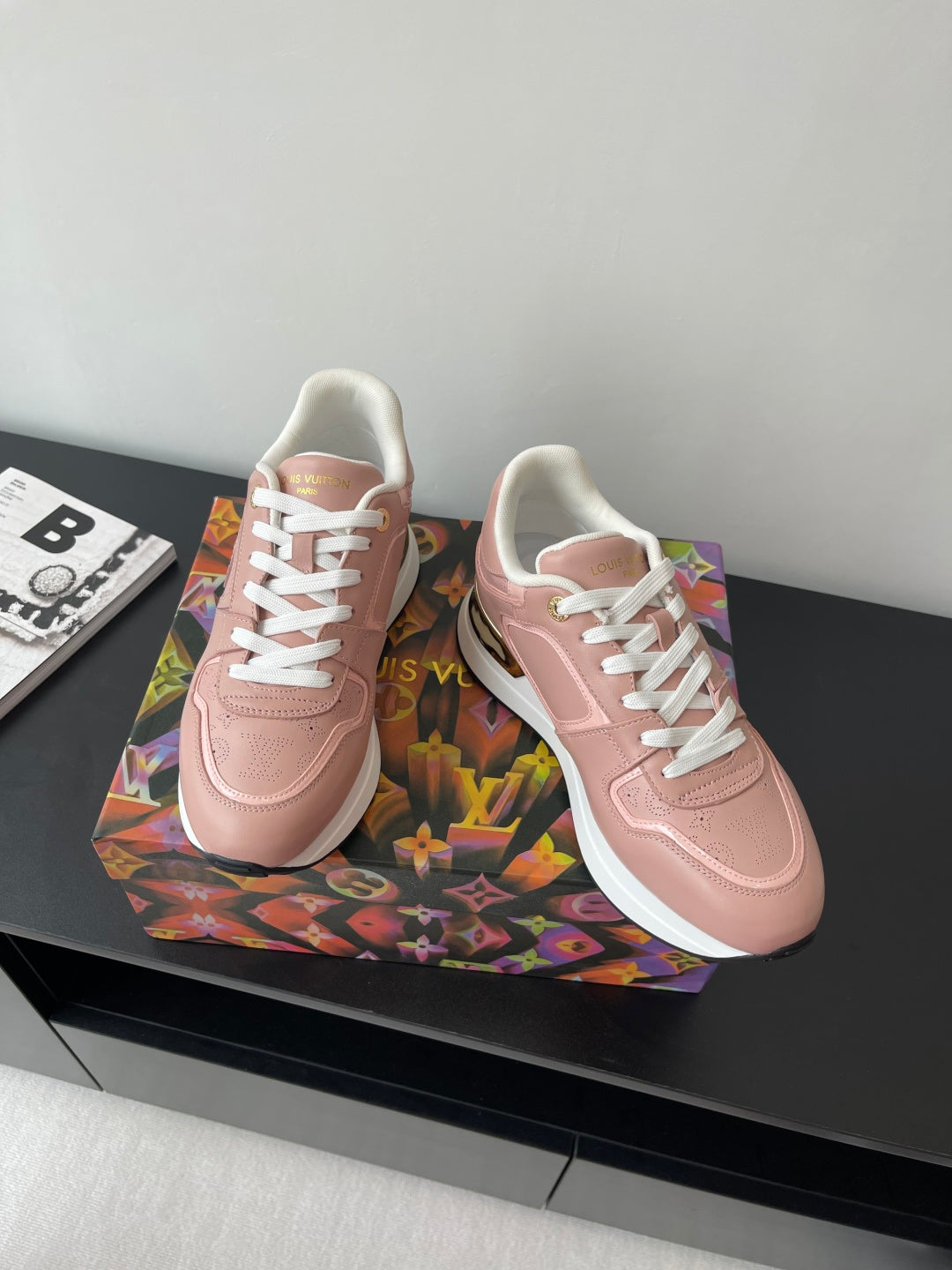 Women's Louis Vuitton sneakers, blush pink with white laces and signature side logo.