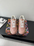 Women's Louis Vuitton sneakers, blush pink with white laces and embossed logo.