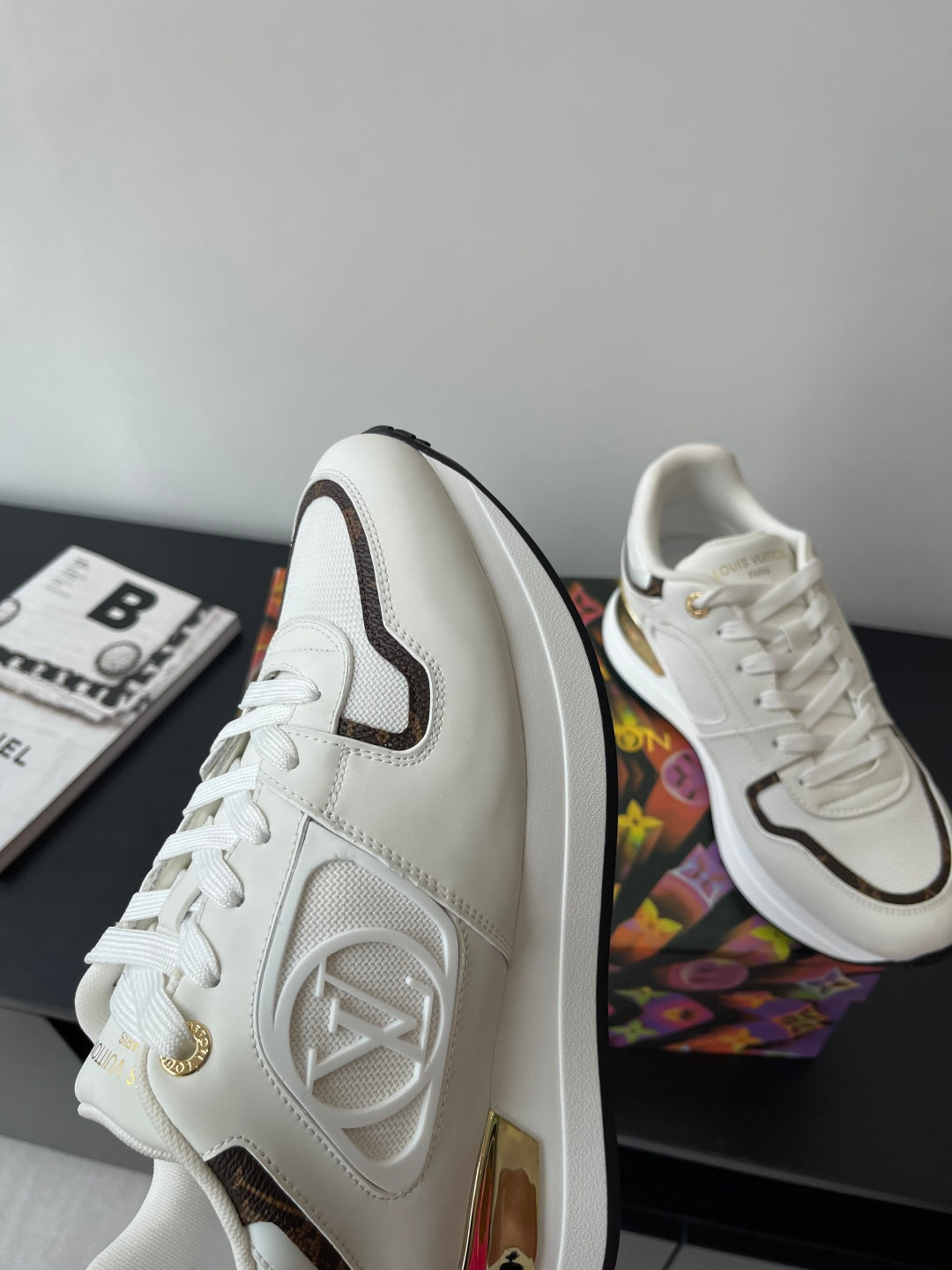 Louis Vuitton ladies sneakers, white with dark side stripe and gold logo detail, lace-up