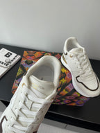 Louis Vuitton ladies sneakers, white leather with embossed monogram-style logo on tongue