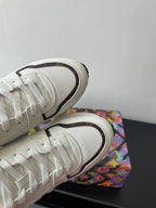 Louis Vuitton ladies sneakers, white upper with dark edging and textured rubber outsole