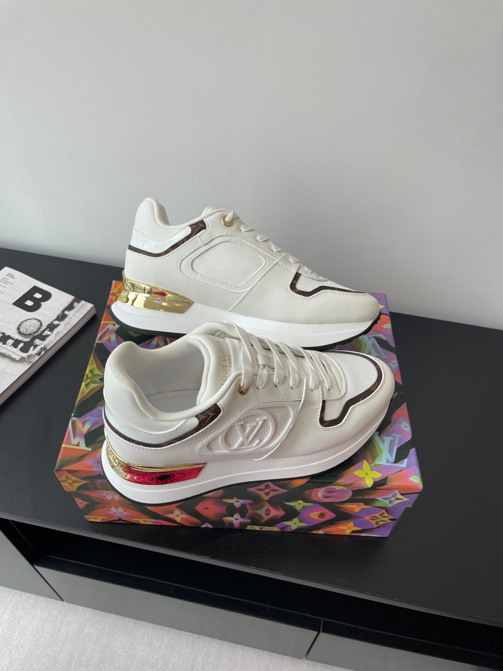 Louis Vuitton ladies sneakers, white with dark logo panel and gold-accented sole