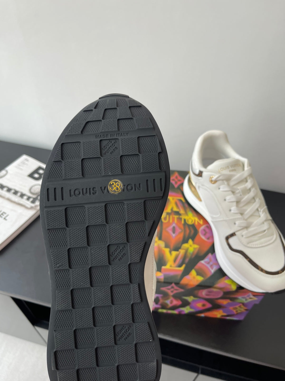 Louis Vuitton ladies sneaker outsole, black tread with embossed Louis Vuitton text