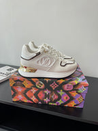 Louis Vuitton ladies sneakers, white with gold accent midsole and LV-style emblem