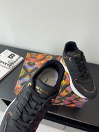 Ladies lace-up sneaker front view, dark upper with LV tongue logo and laces.