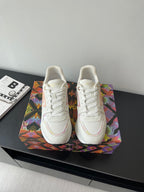 Louis Vuitton women's sneakers, white with pink logo accents, lace-up design