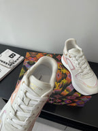 Louis Vuitton women's sneakers, close side view, white with pink trim and stitched details