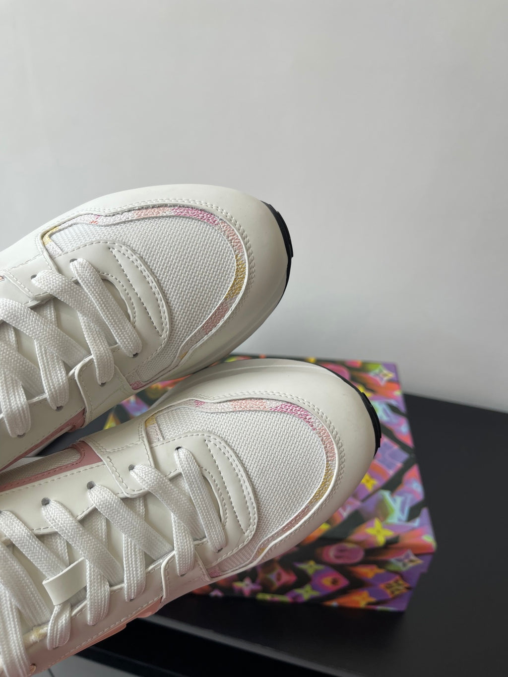 Louis Vuitton women's sneakers, toe close-up, white upper with pink-trim laces