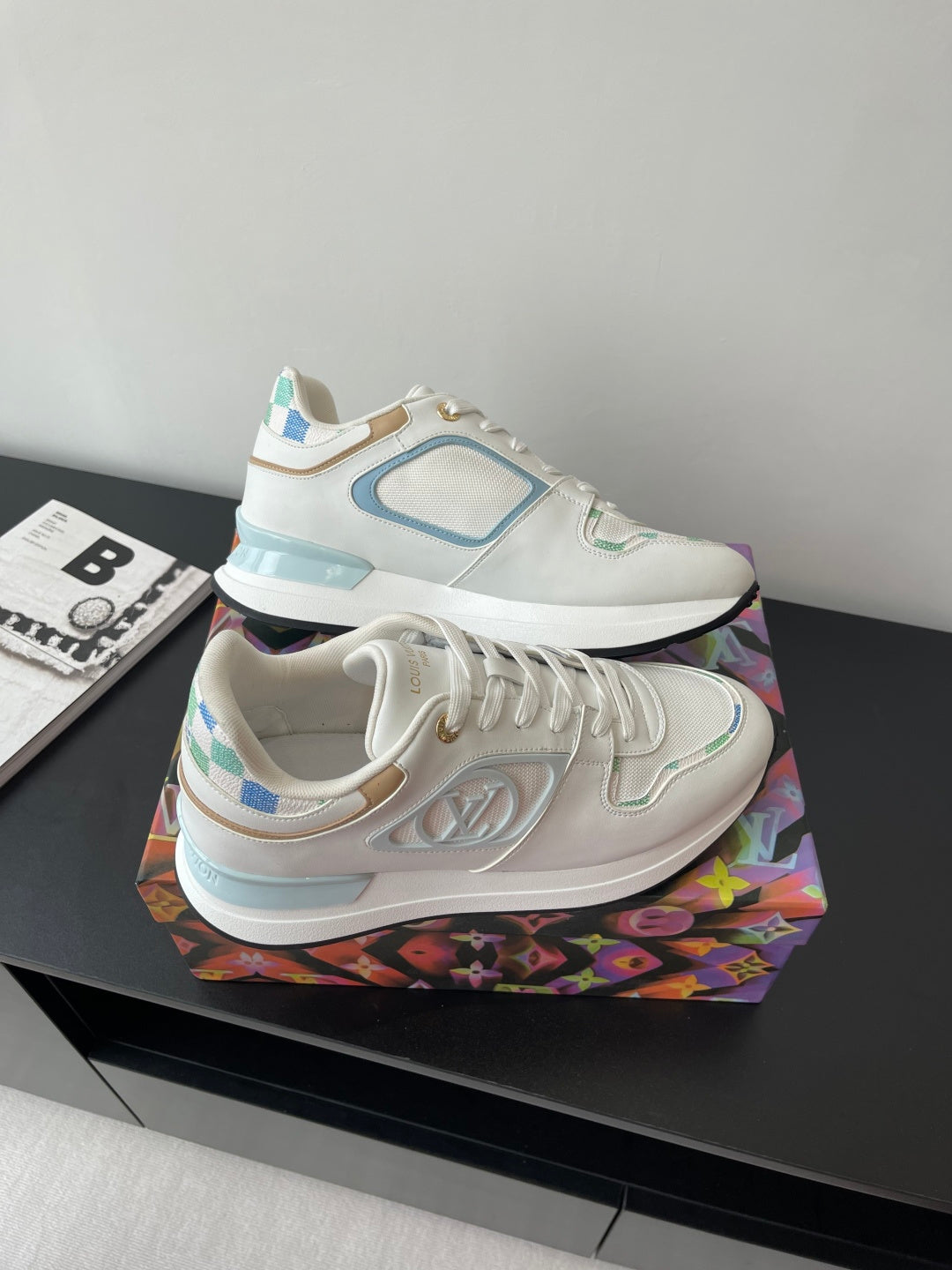 Louis Vuitton women's sneakers, white with light blue swoosh-style side logo