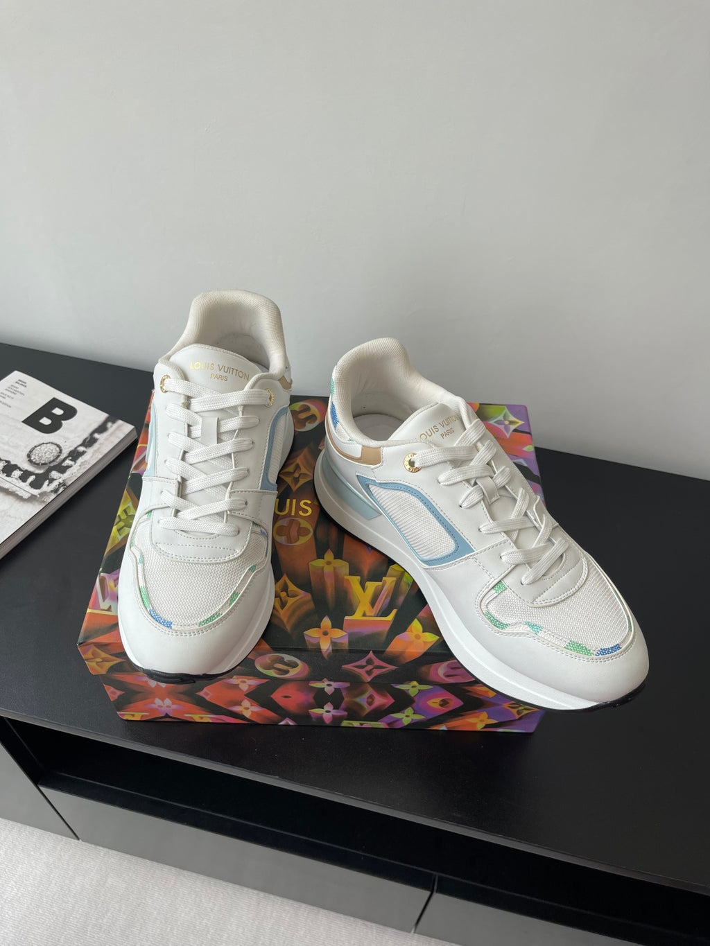 Louis Vuitton women's sneakers, white upper with light blue logo panel and laces