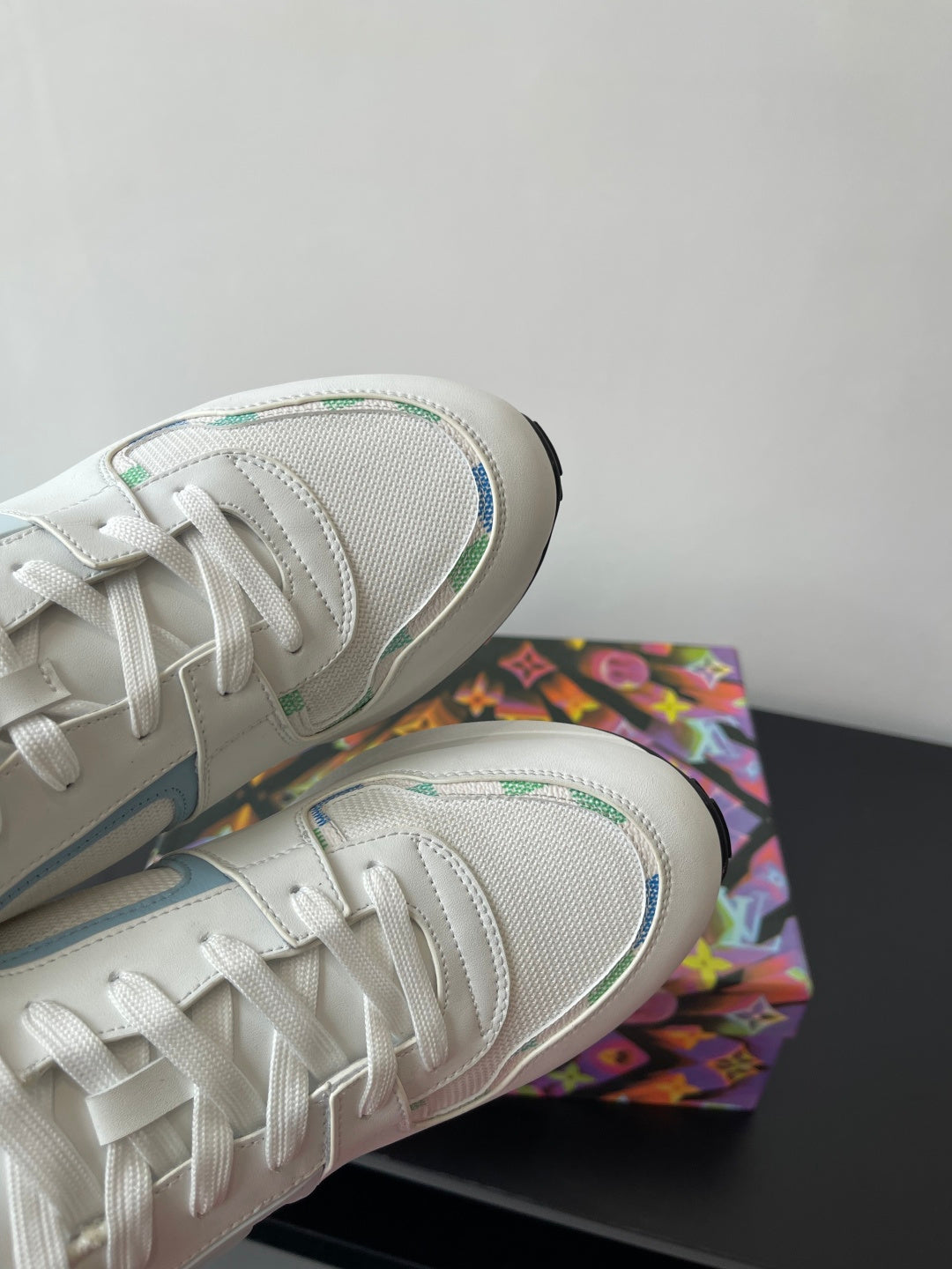 Louis Vuitton women's sneakers detail, white mesh upper with blue logo stitching