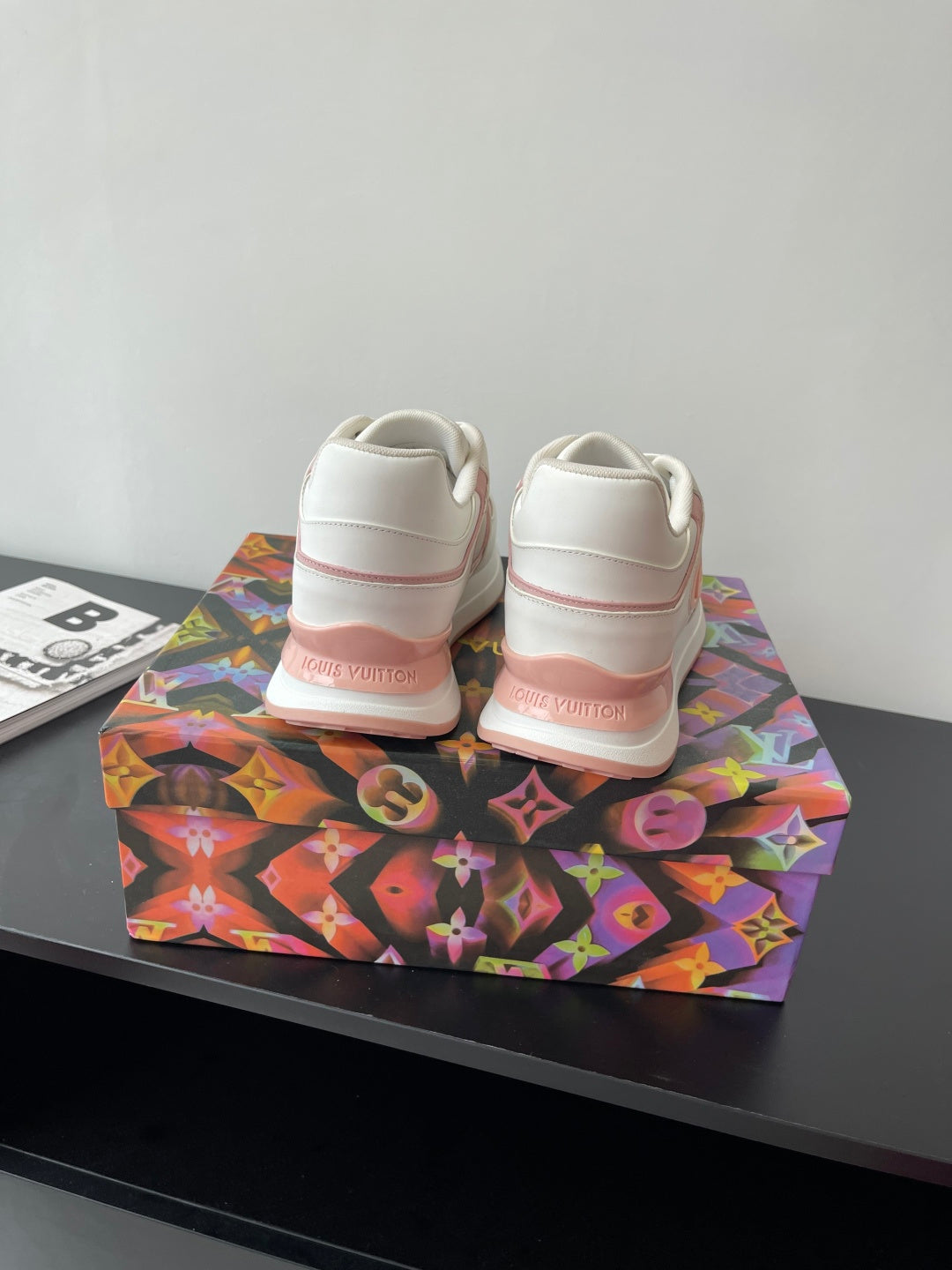 Women's Louis Vuitton sneakers heel view, white uppers with pink stripe detailing