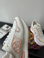 Women's Louis Vuitton sneakers, side and front view in white with pink trim