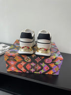 Back view of white Louis Vuitton women’s sneakers with black heel panels