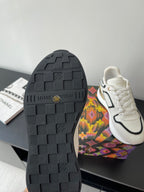 Louis Vuitton sneaker outsole with textured tread; white upper on the side