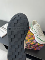 Louis Vuitton women's sneaker outsole, dark tread with embossed brand lettering.