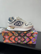 White and navy Louis Vuitton lace-up sneakers with colorful sole detail