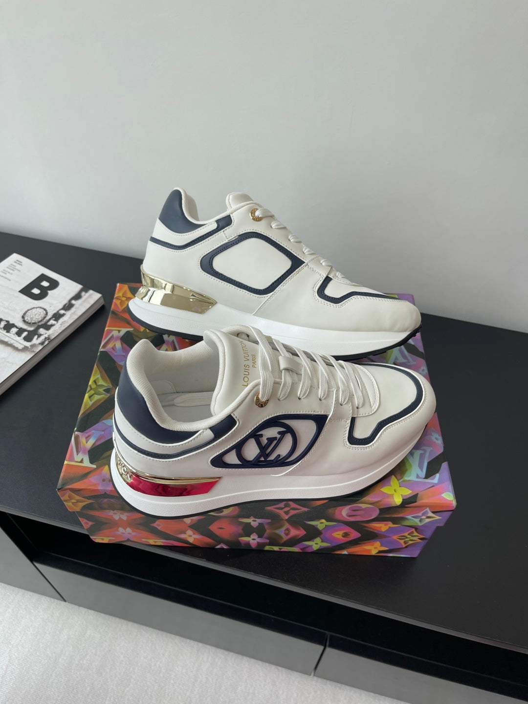 White and navy Louis Vuitton lace-up sneakers with multicolor heel accent