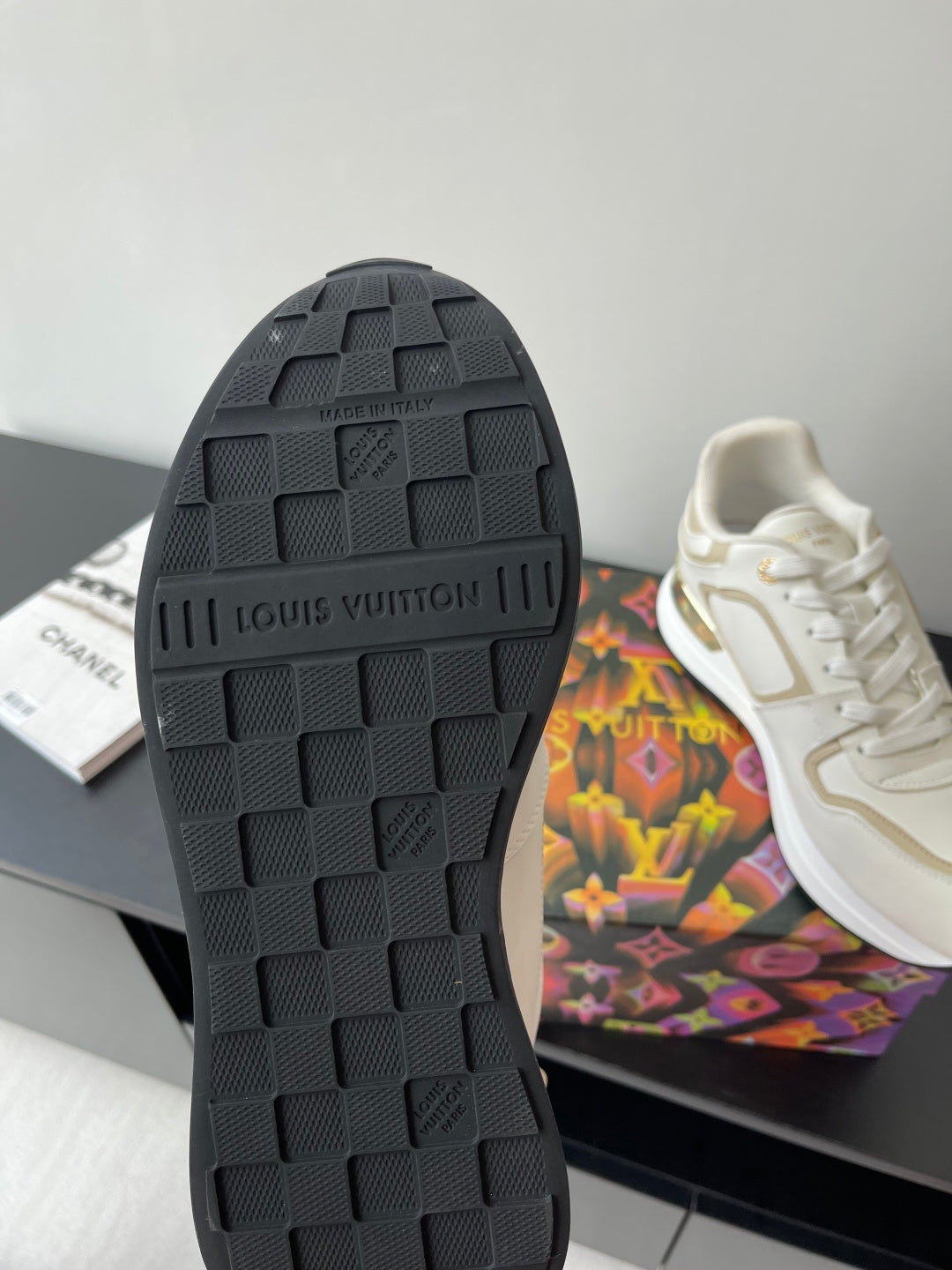 Louis Vuitton sneaker outsole, dark rubber tread with raised brand lettering