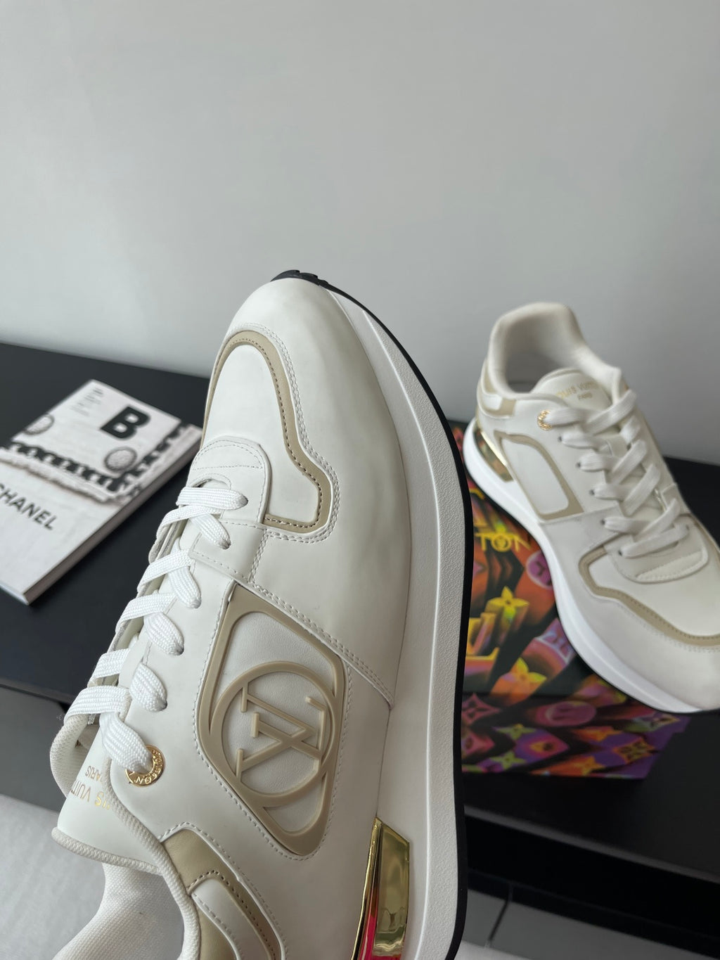 Louis Vuitton white low-top sneakers with side logo and lace-up front