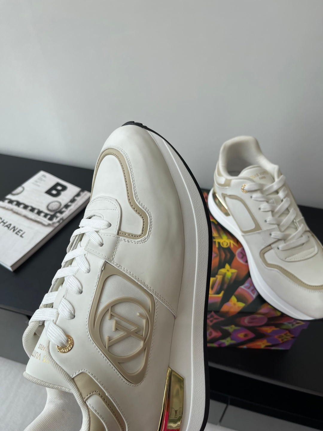 Louis Vuitton white low-top sneakers with side logo and lace-up front