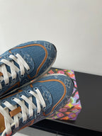 Louis Vuitton ladies sneakers heel and toe view, blue denim texture with white laces.