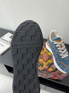 Louis Vuitton ladies sneakers outsole, dark tread with logo detail; blue upper visible.