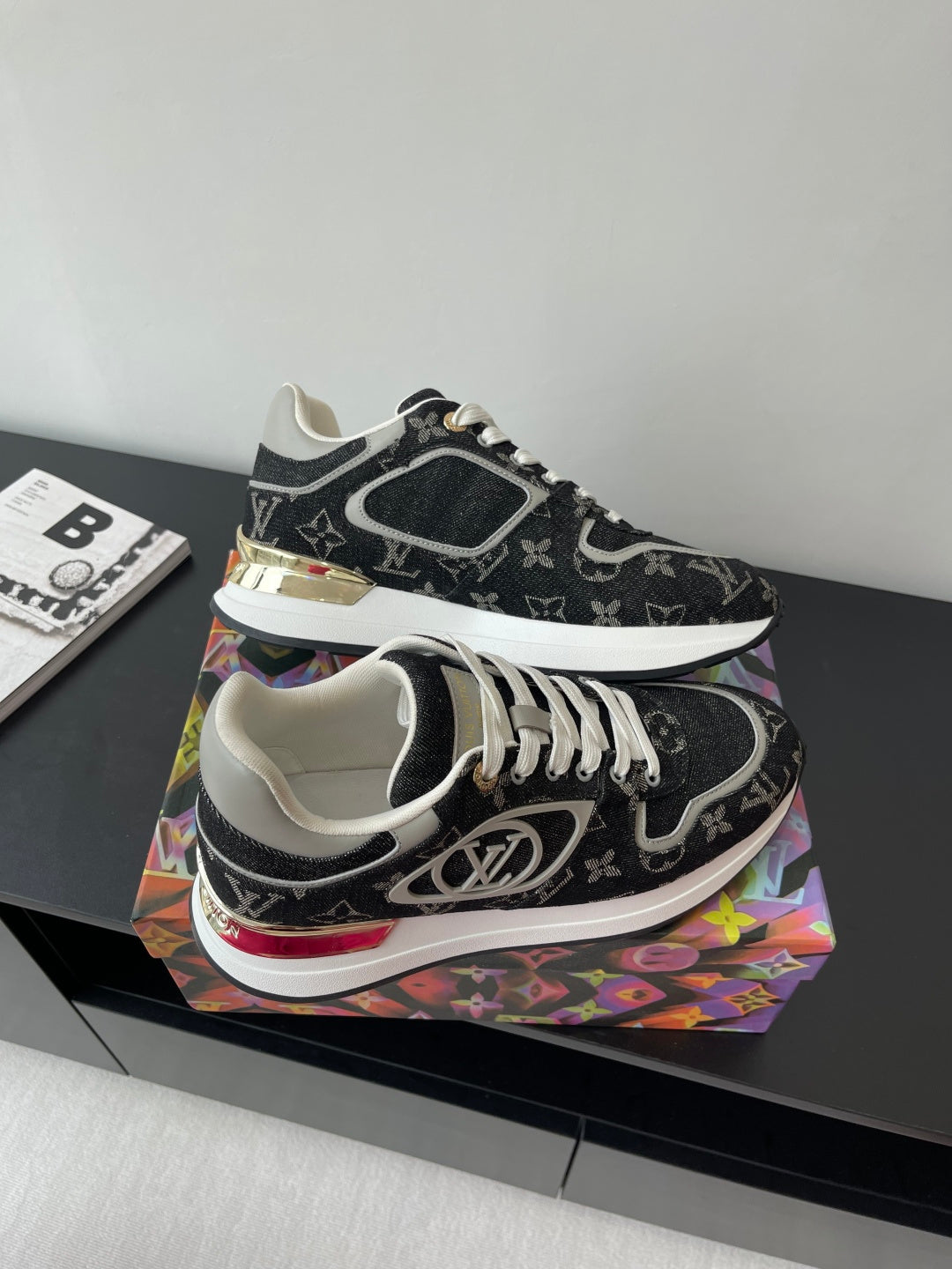 Women’s low-top sneakers, black monogram, white laces, gold-accent midsole