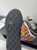 Sneaker outsole, dark rubber tread with Louis Vuitton logo and grip pattern