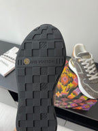 Black rubber outsole with rectangular tread and embossed brand markings