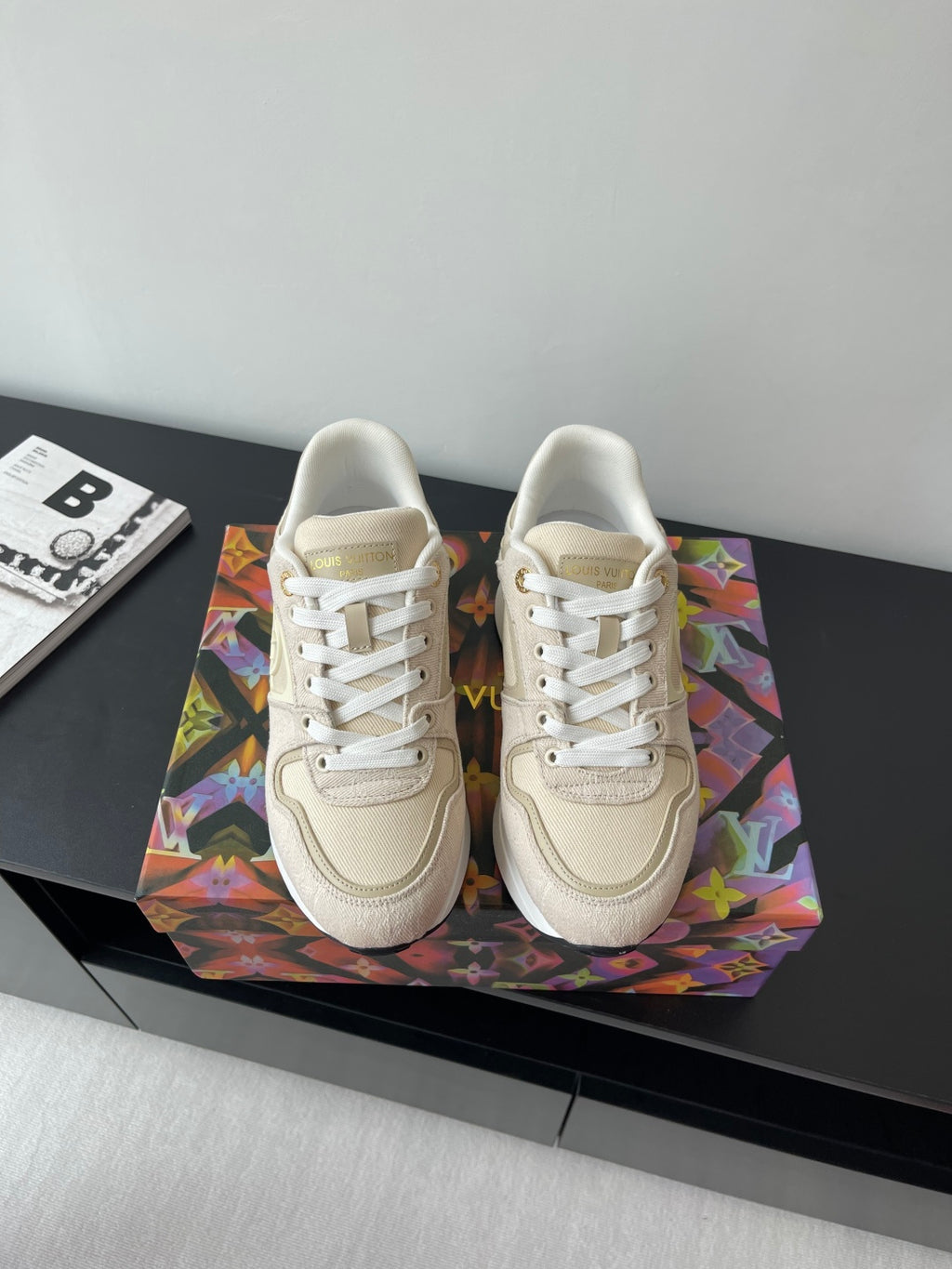 Women's cream lace-up sneakers with gold LV logo on side