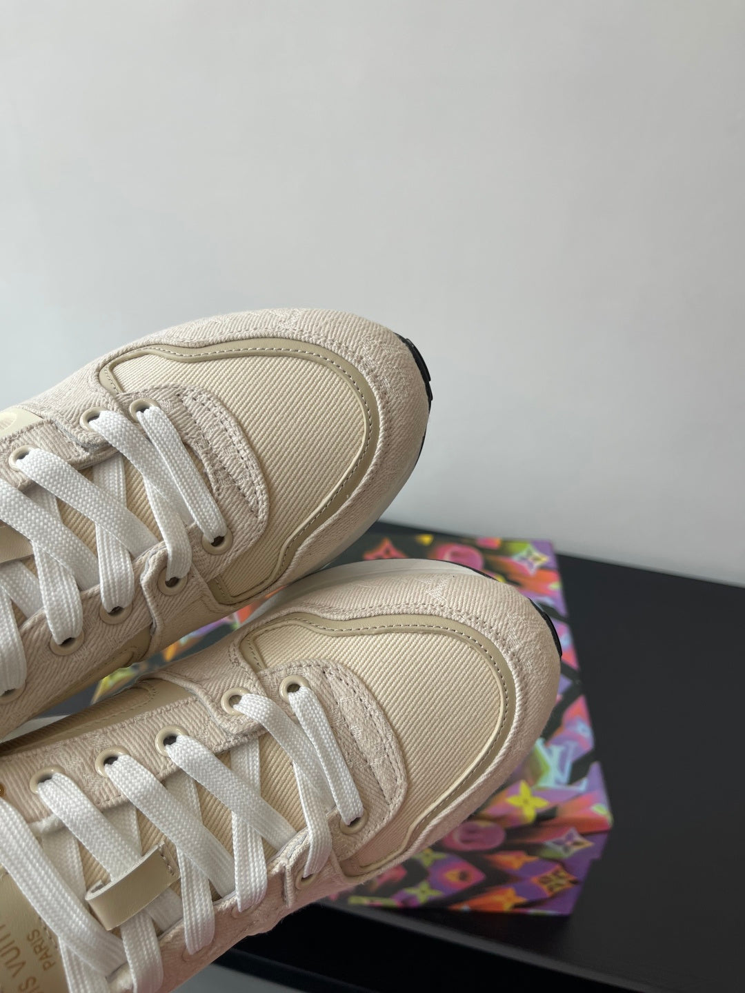 Women's cream sneaker upper with textured side panels and lace eyelets