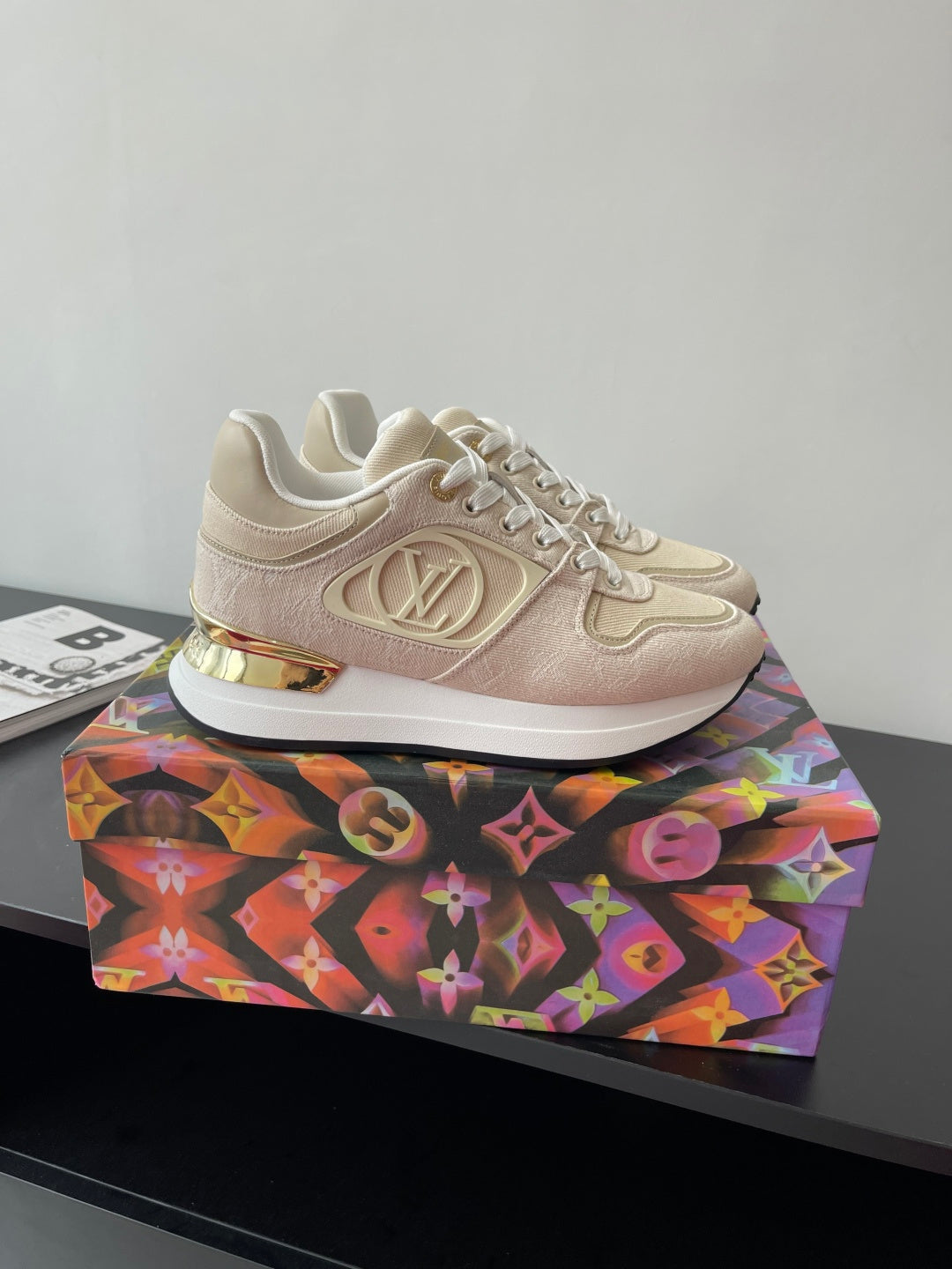 Women's cream lace-up sneakers with gold LV emblem and white rubber sole
