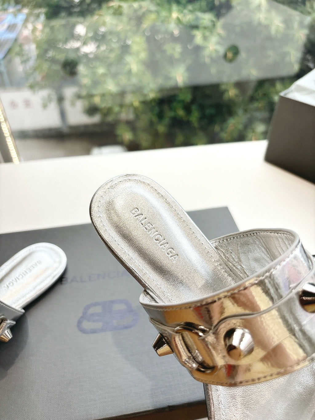 Balenciaga ladies metallic silver slide sandal with textured lining and buckle strap detail